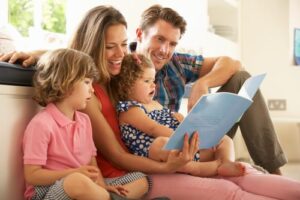 parents reading with children in family room